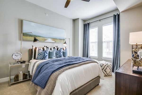 Cozy bedroom with modern design at The Kathryn Apartments