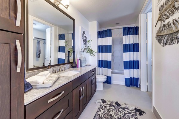 Spacious bathroom with modern fixtures in The Kathryn Apartments