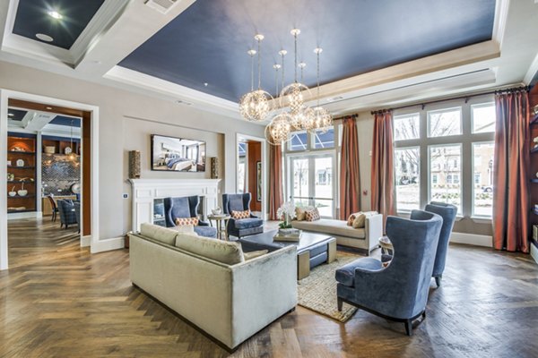 Lobby area with sleek furnishings and modern design at The Kathryn Apartments clubhouse