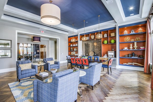 Clubhouse lobby featuring modern seating and elegant lighting at The Kathryn Apartments