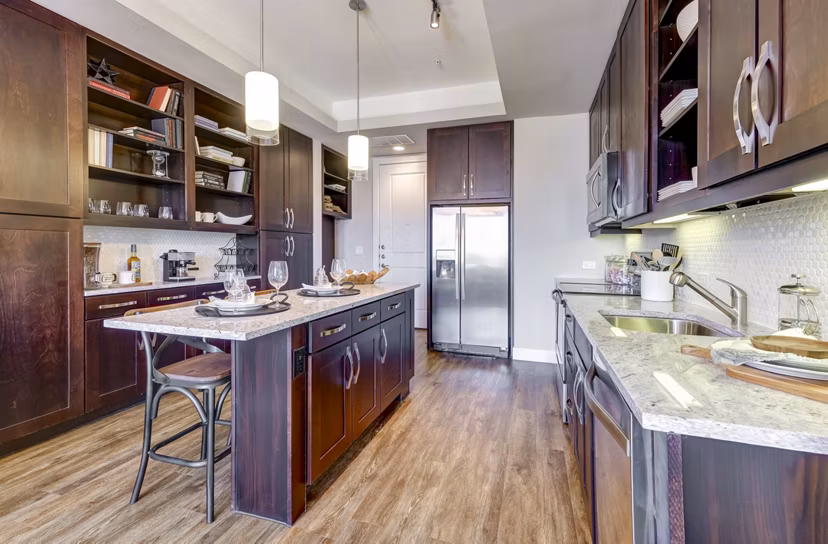 Modern kitchen with stainless steel appliances at The Kathryn Apartments