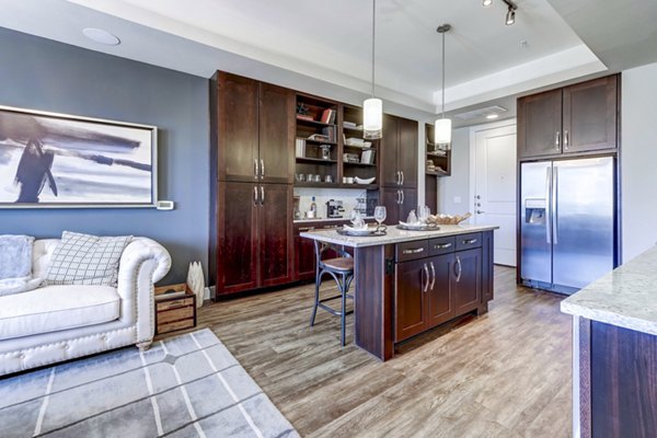 Modern kitchen with stainless steel appliances in The Kathryn Apartments
