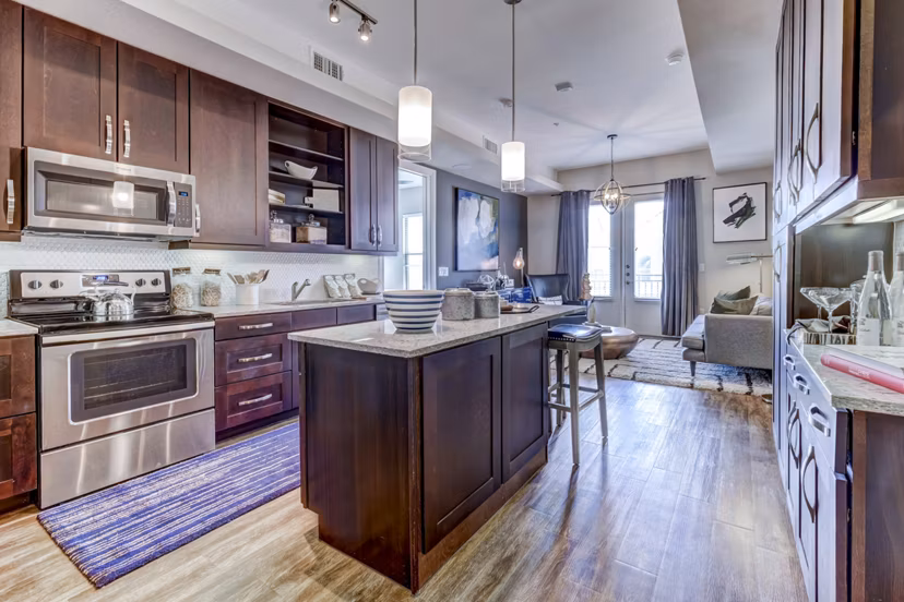 Modern kitchen with stainless steel appliances at The Kathryn Apartments