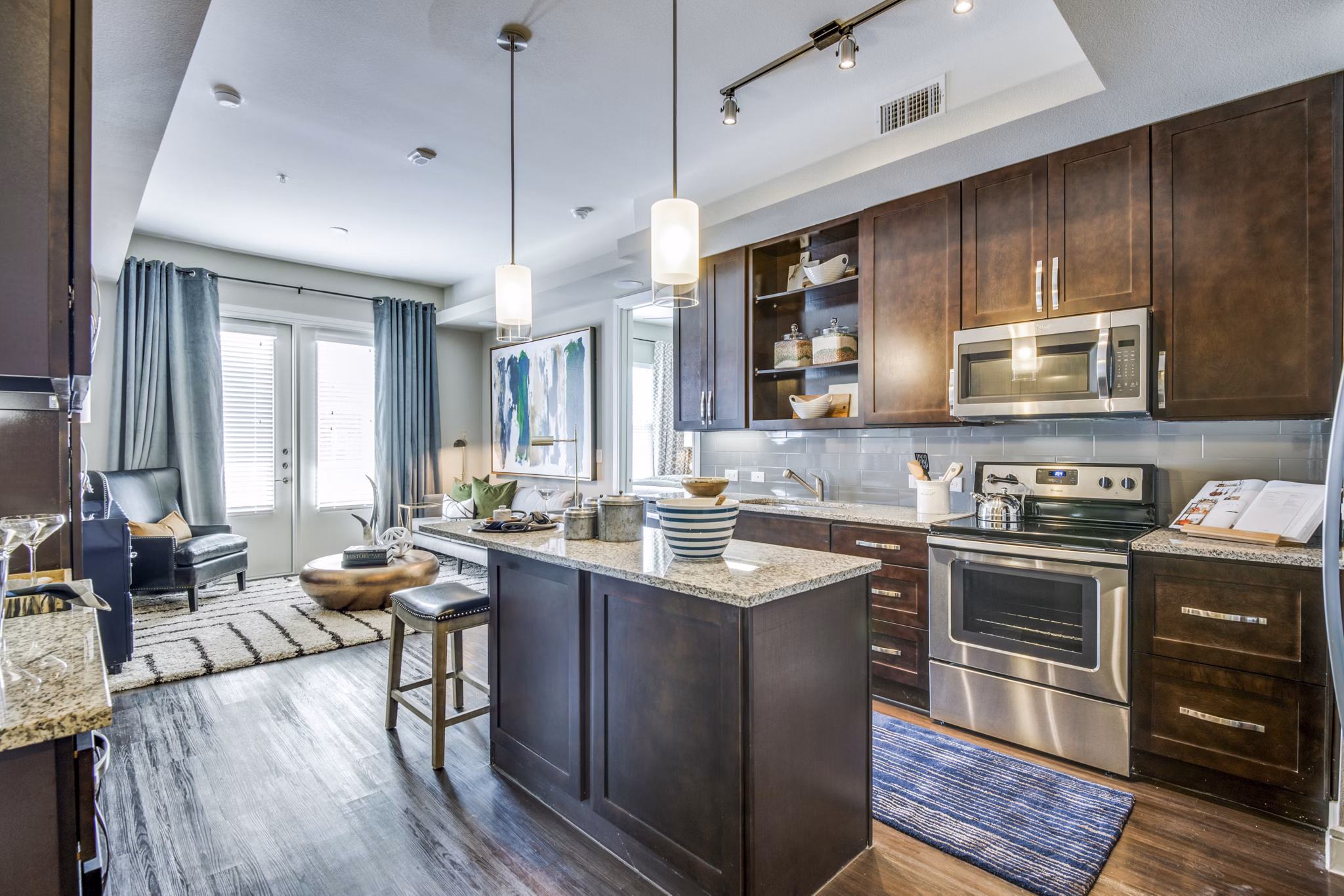 Contemporary kitchen with sleek countertops and modern appliances in The Kathryn Apartments