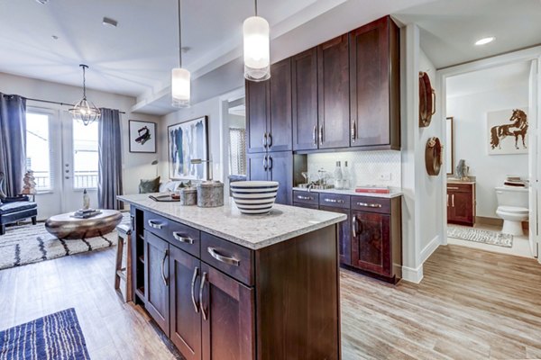 Modern kitchen with stainless steel appliances at The Kathryn Apartments