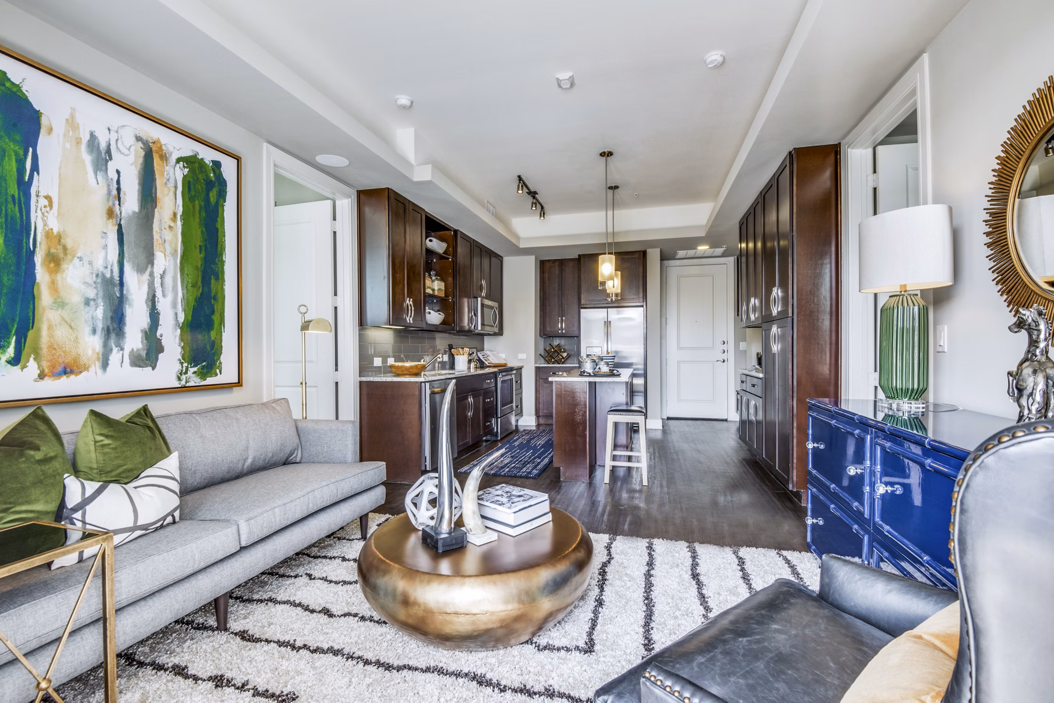 Modern living room with plush seating and stylish decor at The Kathryn Apartments