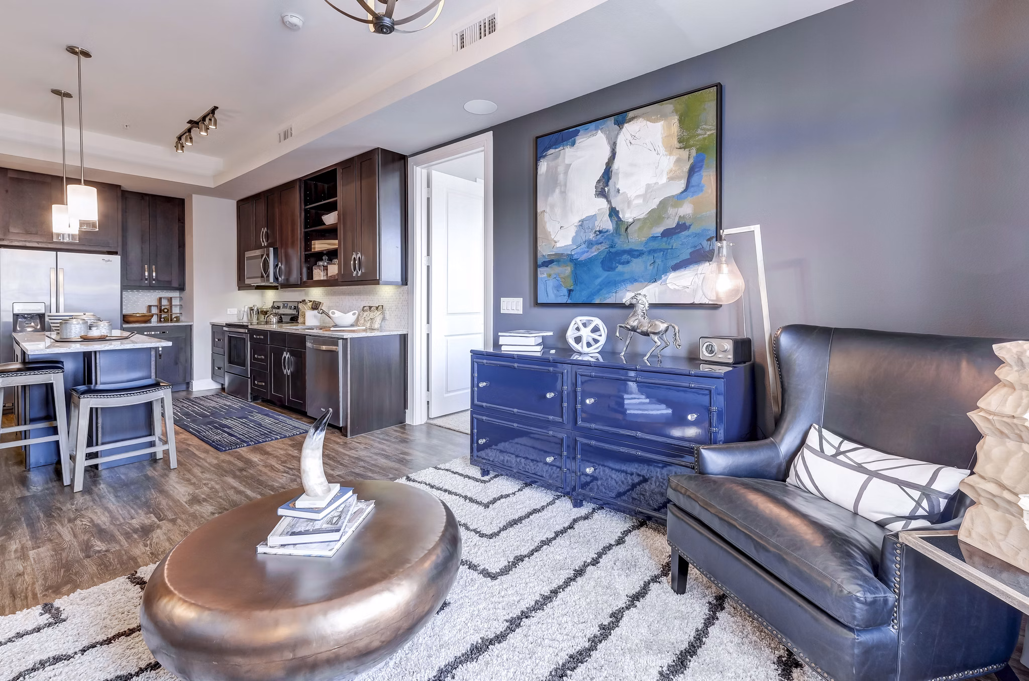 Modern living room featuring stylish decor and natural light at The Kathryn Apartments