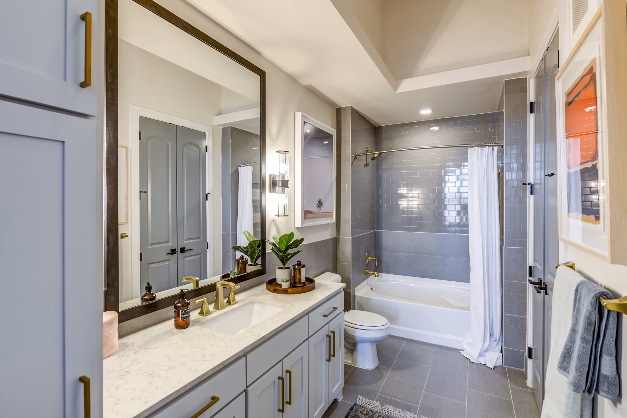Modern bathroom with sleek fixtures at The Margo Apartments, offering luxurious living in a prime location