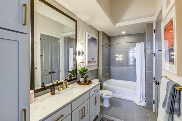 Modern bathroom with sleek fixtures at The Margo Apartments, offering luxurious living in a prime location