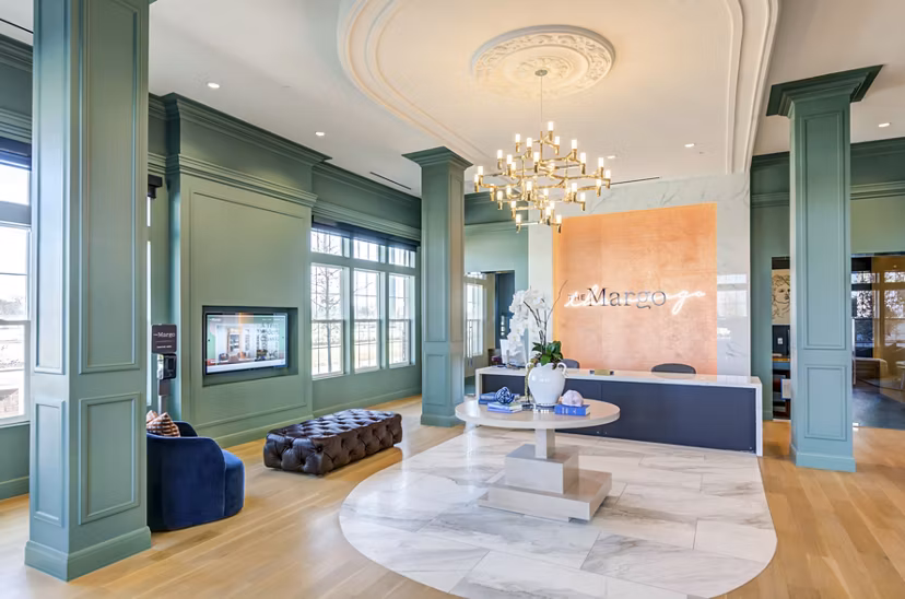 Welcoming clubhouse lobby with modern decor at The Margo Apartments, ideal for social gatherings and relaxation