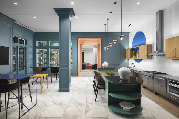 The Margo Apartments: Stylish clubhouse lobby featuring contemporary decor and seating areas