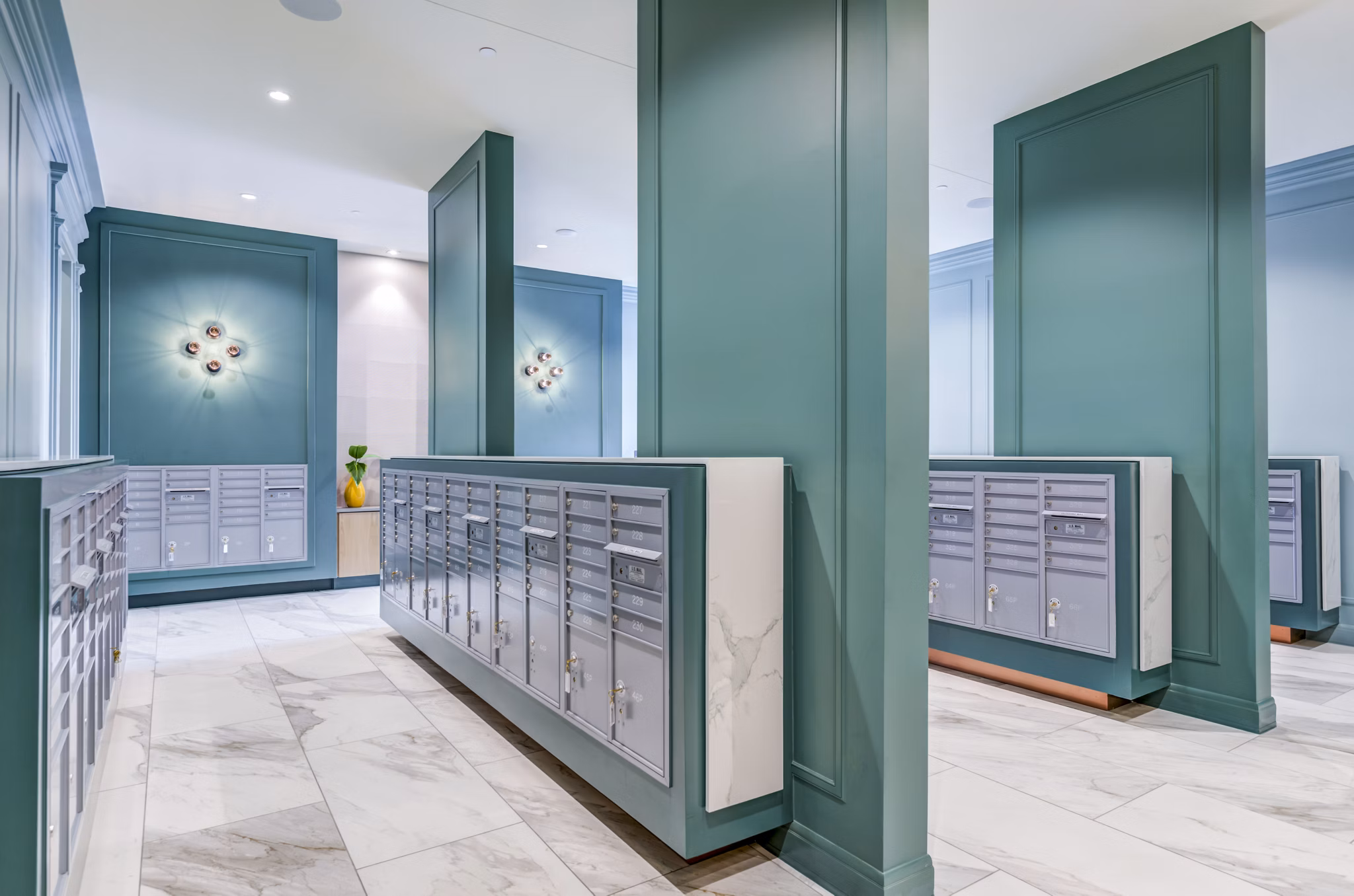 Secure mail room with modern storage lockers at The Margo Apartments