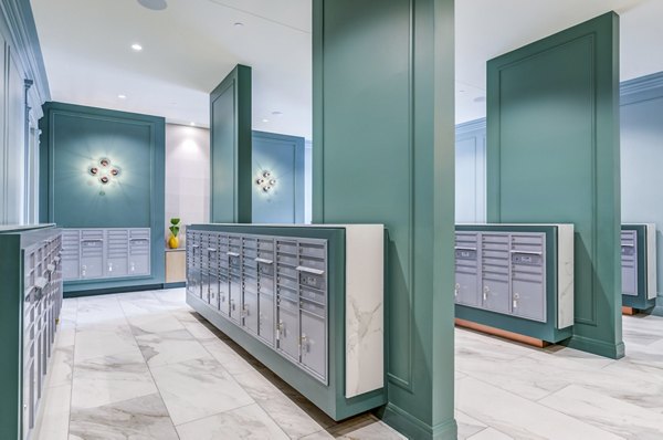 Secure mail room with modern storage lockers at The Margo Apartments