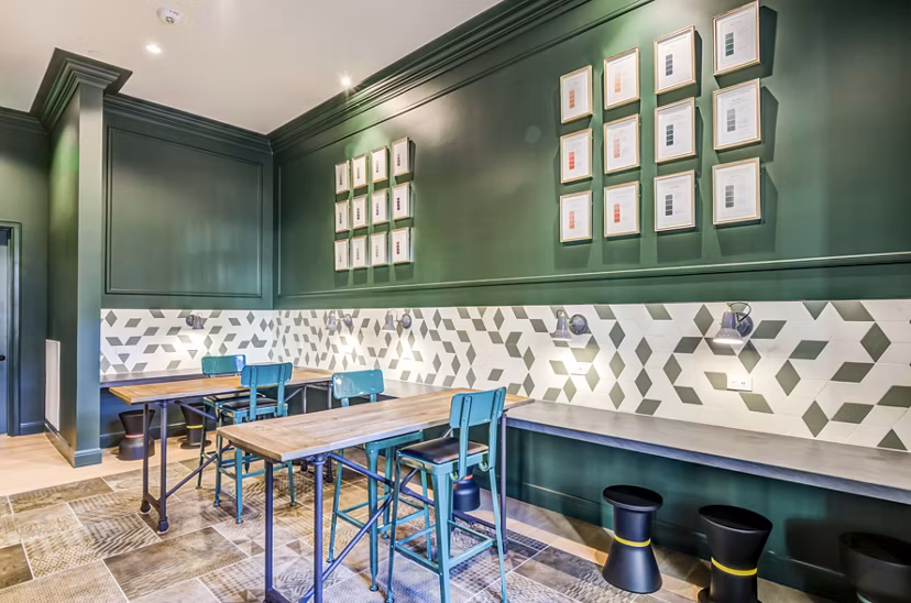Clubhouse lobby with modern decor and seating at The Margo Apartments