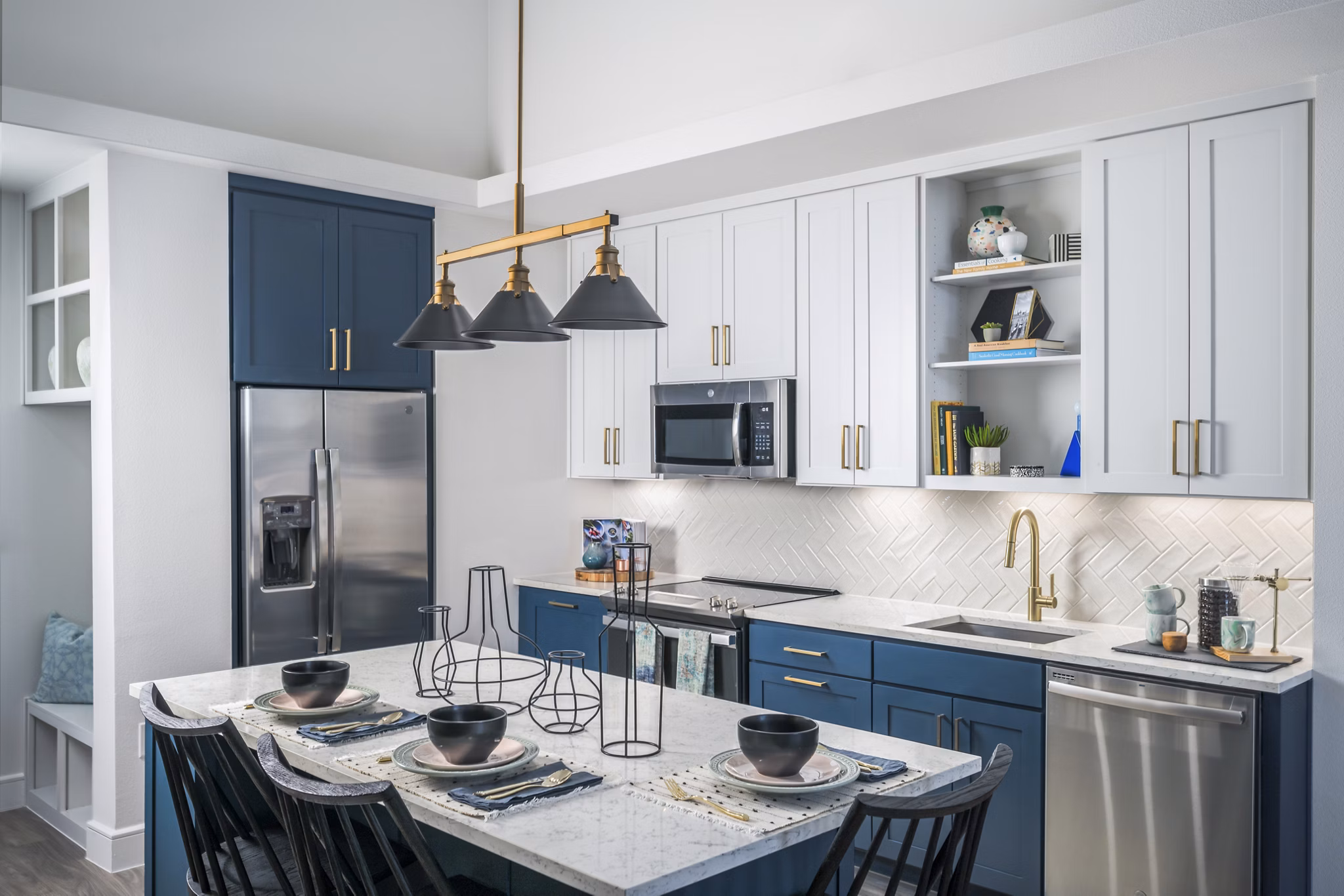 Modern kitchen with stainless steel appliances at The Margo Apartments