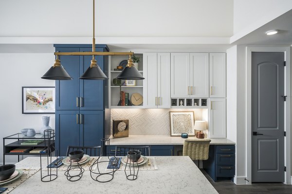 Modern kitchen with stainless steel appliances at The Margo Apartments