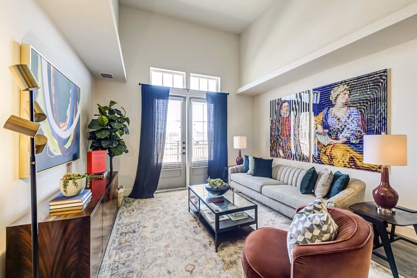 Spacious living room with modern decor in The Margo Apartments, offering luxury urban living
