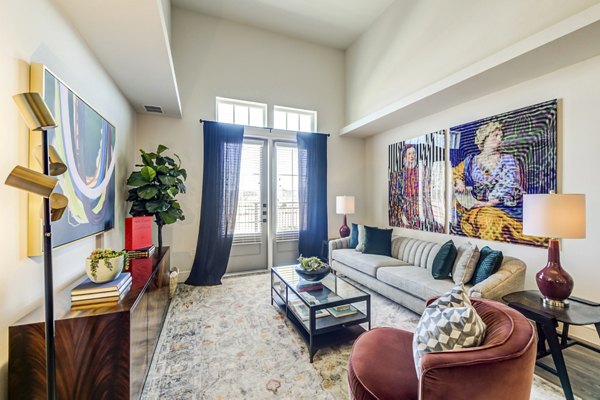 Spacious living room with modern decor in The Margo Apartments, offering luxury urban living
