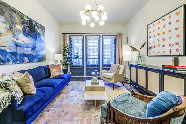 Spacious living room with modern decor at The Margo Apartments