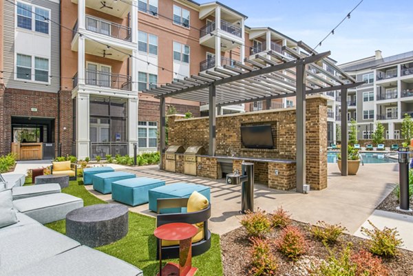 Outdoor grill area on the modern patio at The Margo Apartments offering luxury living experiences