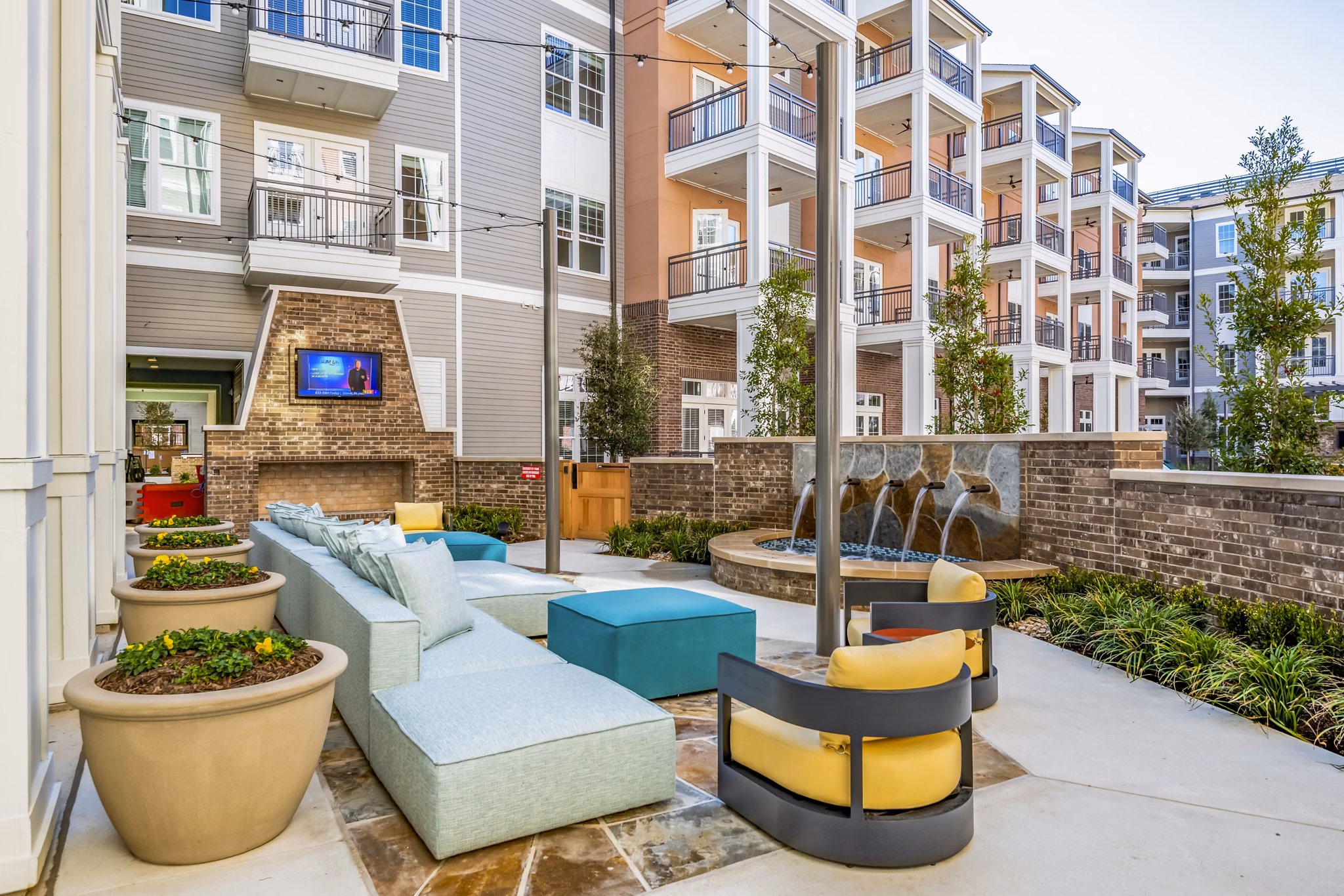 Cozy fire pit on spacious patio at The Margo Apartments