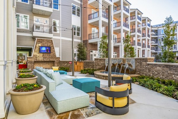Cozy fire pit on spacious patio at The Margo Apartments