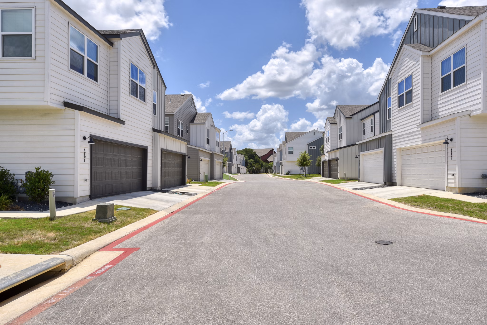 Farm Haus Luxury Rental Homes: Modern architecture and lush landscaping in upscale community