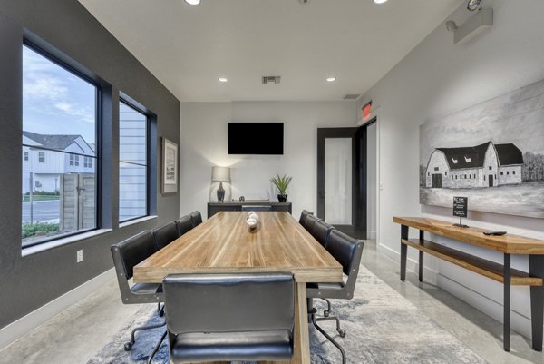 Home office setup featuring modern desk and chair in Farm Haus Luxury Rental Homes