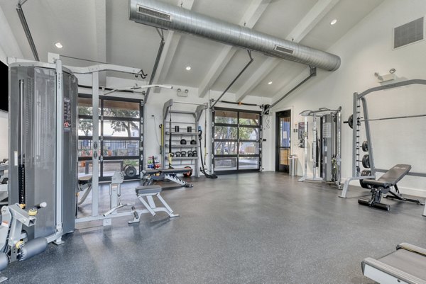 State-of-the-art fitness center at Farm Haus Luxury Rental Homes Apartments with modern equipment for resident workouts