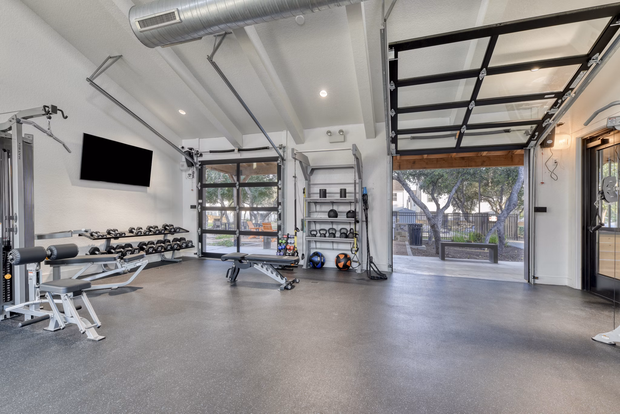 Fitness center with state-of-the-art equipment at Farm Haus Luxury Rental Homes Apartments