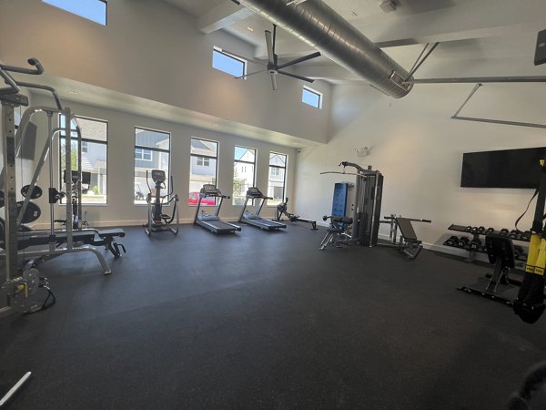 Fitness center with state-of-the-art equipment at Farm Haus Luxury Rental Homes Apartments