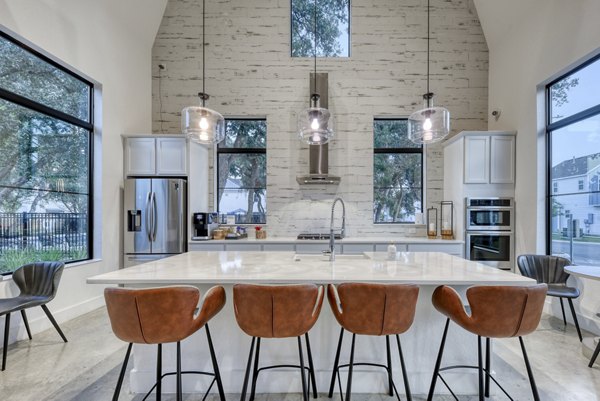 Modern kitchen with stainless steel appliances at Farm Haus Luxury Rental Homes Apartments