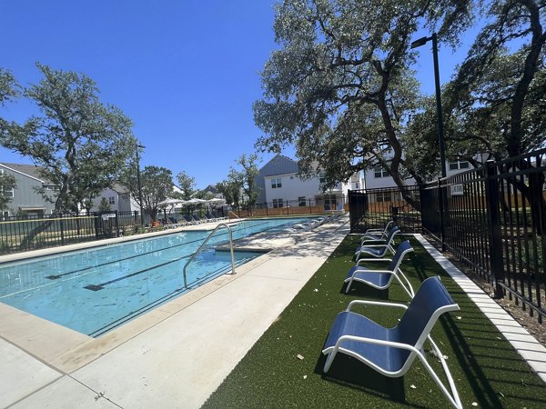 Resort-style swimming pool at Farm Haus Luxury Rental Homes offering relaxation and recreational amenities