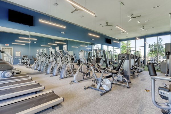 Modern fitness center with state-of-the-art equipment at The View at TPC Apartments offering comprehensive workout options