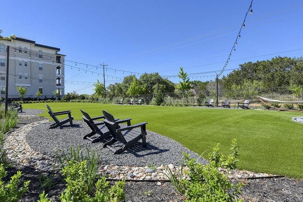 Courtyard with lush landscaping and seating at The View at TPC luxury apartments