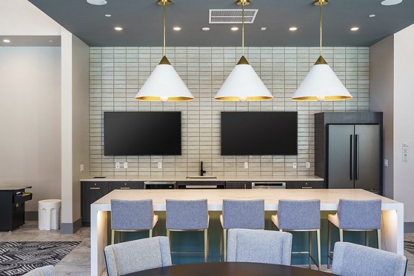 Clubhouse with modern design and cozy seating at Rowe at Pear Village Apartments