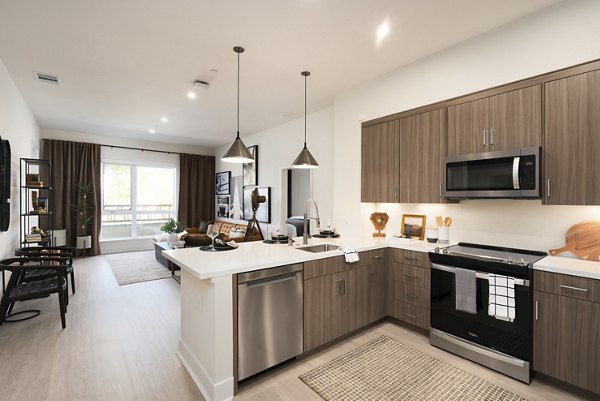 Kitchen featuring modern appliances at Rowe at Pear Village Apartments