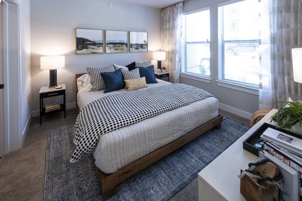 Cozy bedroom with modern furnishings at Union House Apartments