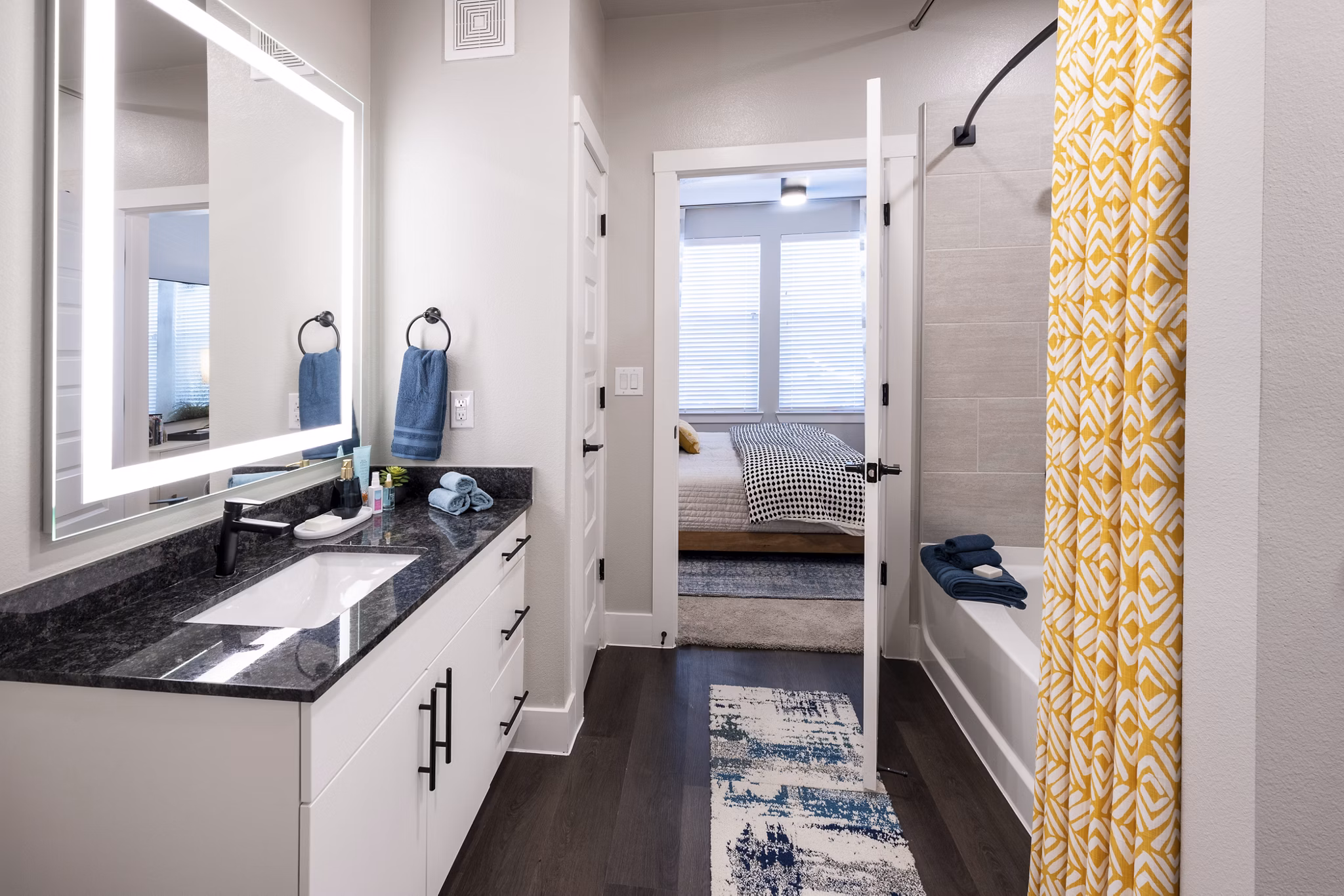 Modern bathroom with sleek fixtures and marble accents in Union House Apartments