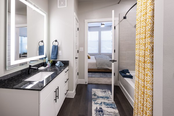 Modern bathroom with sleek fixtures and marble accents in Union House Apartments