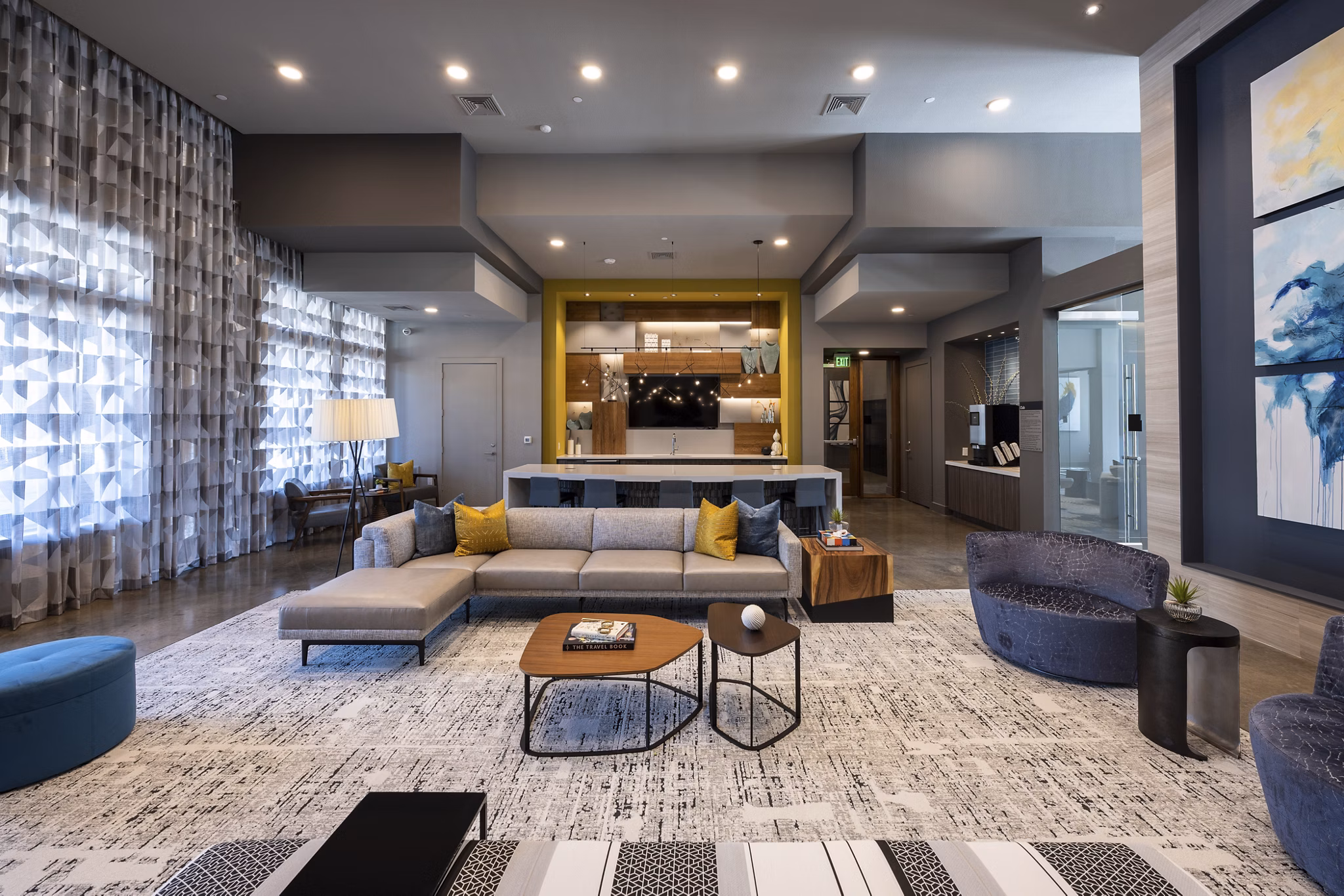 Clubhouse with stylish seating and fireplace at Union House Apartments, offering luxury living