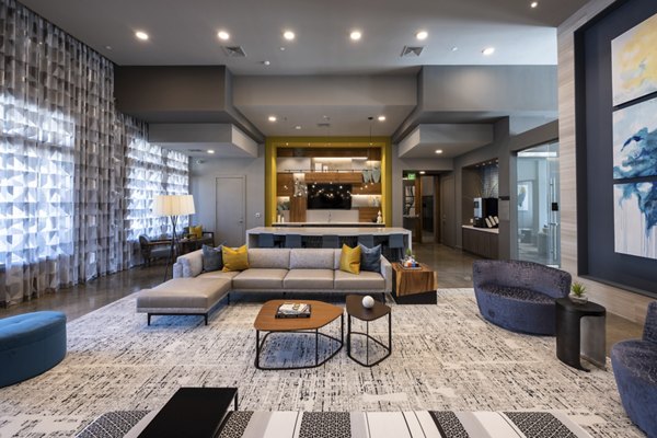 Clubhouse with stylish seating and fireplace at Union House Apartments, offering luxury living