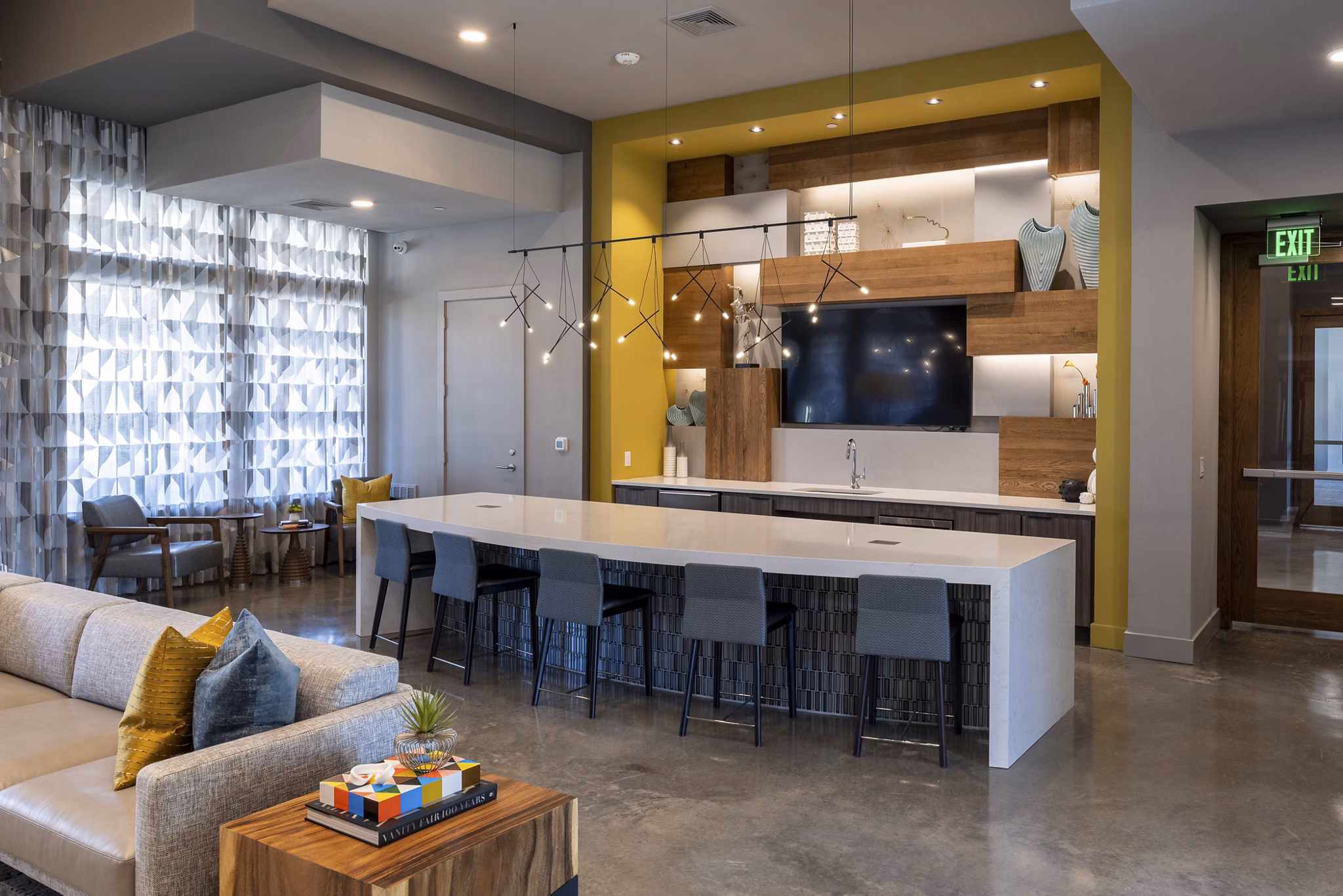 Modern clubhouse with cozy seating and entertainment options at Union House Apartments