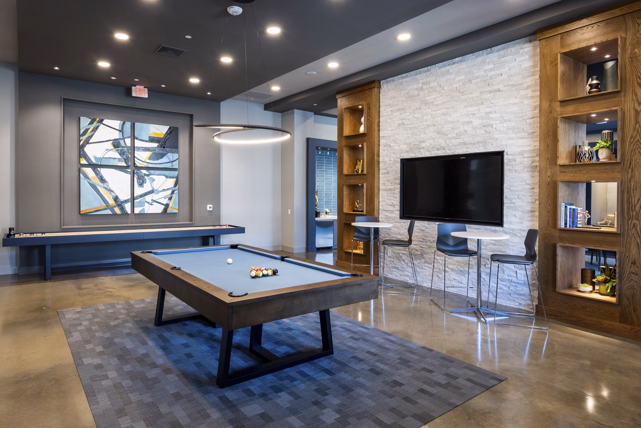 Modern clubhouse with stylish seating and billiards table at Union House Apartments luxury community