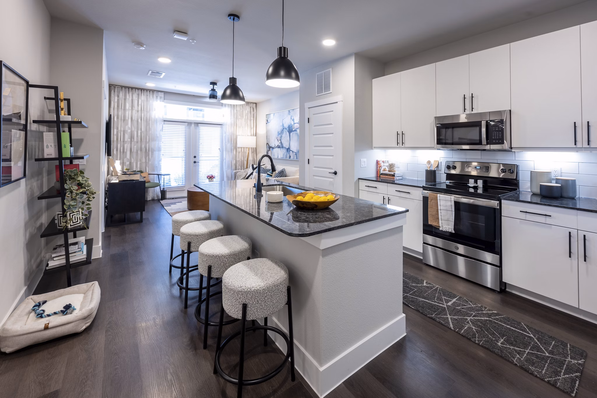 Modern kitchen with stainless steel appliances in Union House Apartments