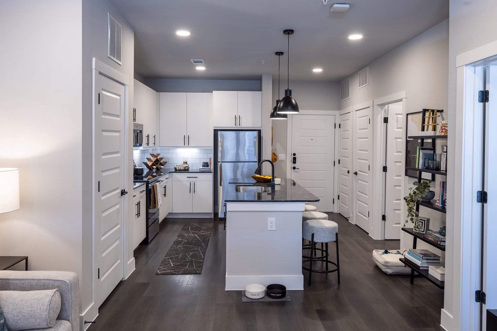 Modern kitchen with stainless steel appliances at Union House Apartments, luxury living by Greystar
