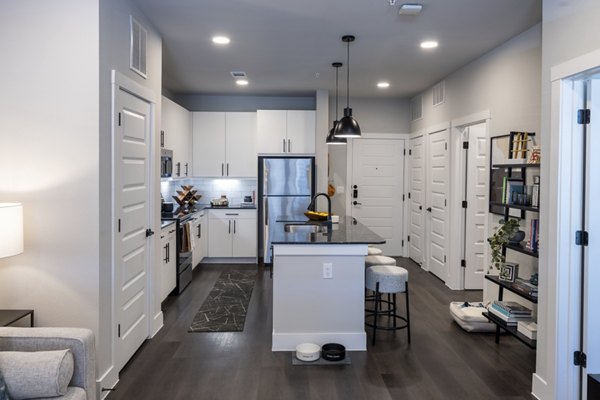 Modern kitchen with stainless steel appliances at Union House Apartments, luxury living by Greystar