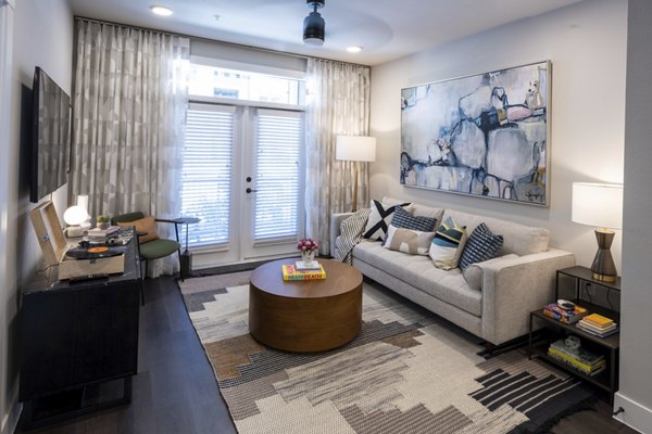Bright living room with modern decor in Union House Apartments luxury community