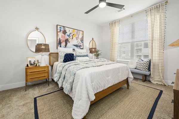 Modern bedroom with elegant decor at Evermore Apartments