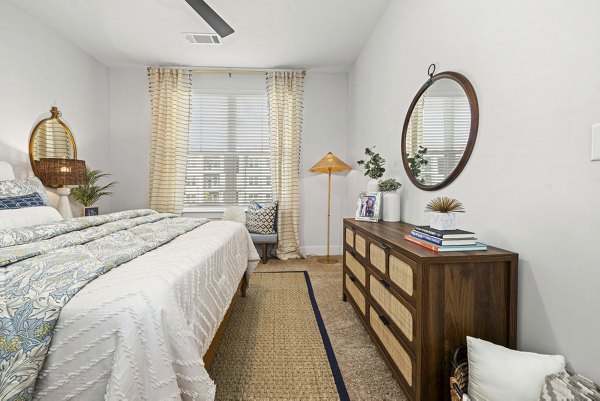 Spacious bedroom with elegant decor at Evermore Apartments